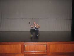me and dudley performing drama on stage at Raffles hotel